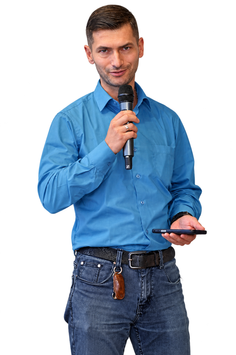 Viktors Silovs holding a microphone.